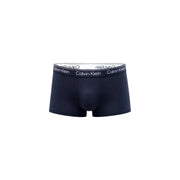 Dark navy calvin klein men’s briefs with white elastic waistband featuring black brand lettering for comfortable wear
