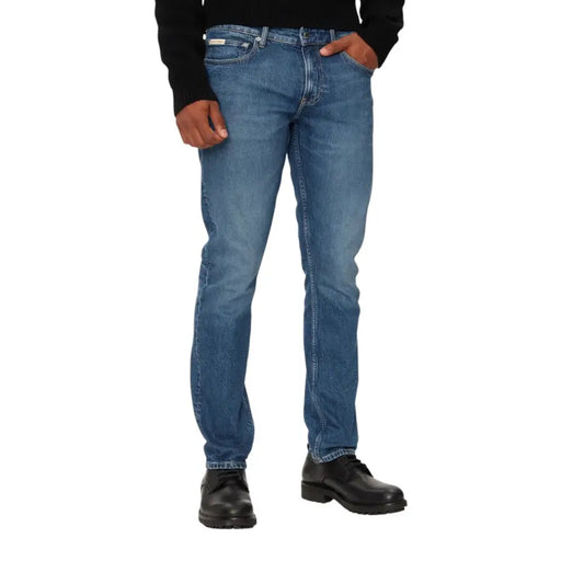 Blue denim jeans with a straight fit and classic design.