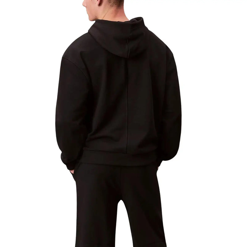 Calvin Klein Sport men black cotton hoodie sweatshirt shown from the back with a central seam down the hooded sweatshirt