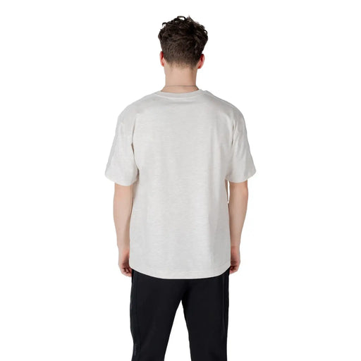 Calvin Klein Sport T-shirt gris en mélange de coton pour homme, avec un design uni blanc cassé à manches courtes et coupe décontractée.