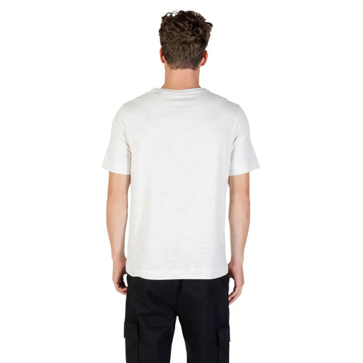T-shirt blanc en coton à col rond t-shirt avec manches courtes, étiquette visible sur le devant Calvin Klein Sport T-shirt gris en mélange de coton pour homme