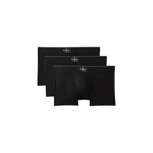 Boxer noir Calvin Klein avec logo blanc discret sur la ceinture, en coton, pour homme.