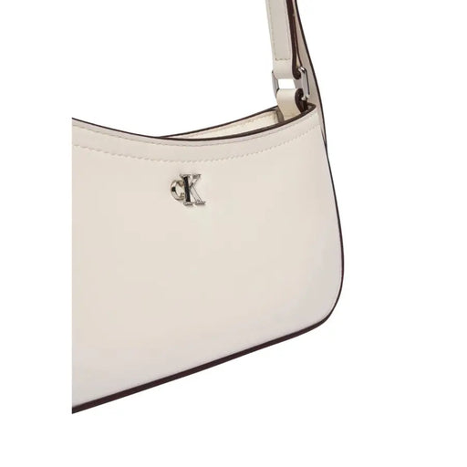 Calvin Klein Sac bandoulière en cuir crème avec logo CK argenté et finitions marron
