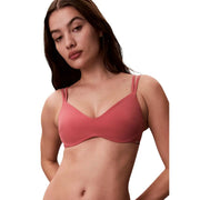 A soft rose-pink seamless underwire bra with thin adjustable straps from Calvin Klein women beachwear bralette collection