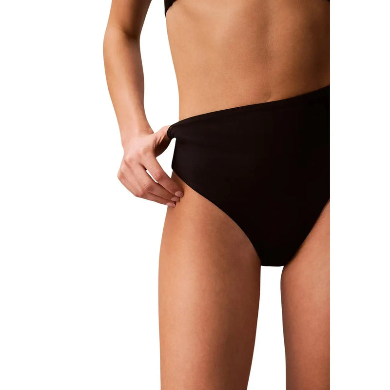 Black Calvin Klein women bikini high waist swimwear bottom with a smooth seamless design ideal for swimwear use