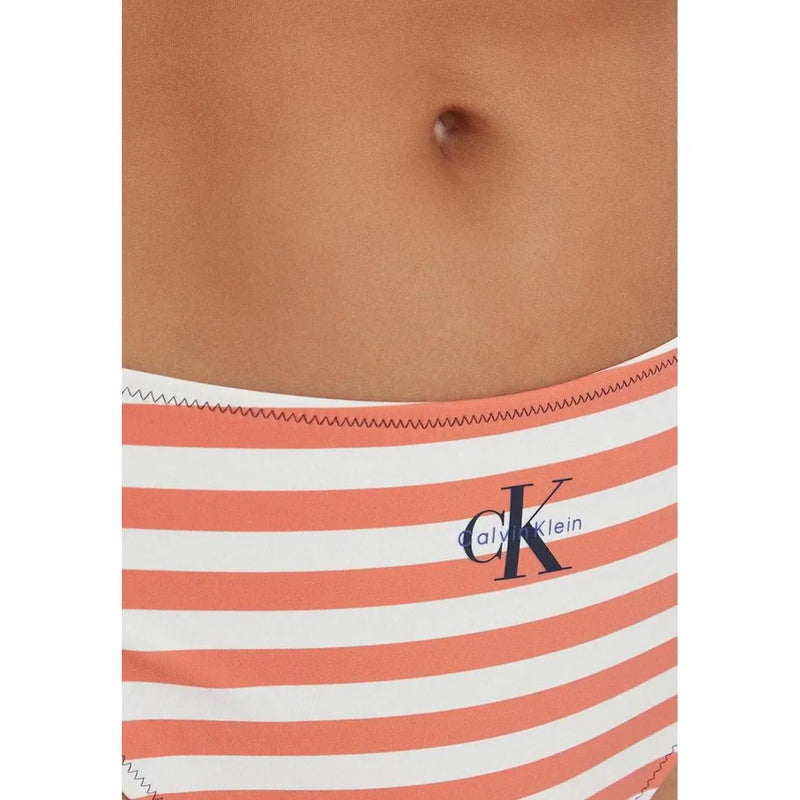 Calvin Klein women bikini bottom in coral and white striped nylon elastane with navy blue CK logo visible from front