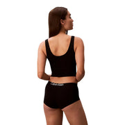 Lot de 3 culottes shorty Calvin Klein noires pour femme, en coton, et débardeur court noir. top avec un décolleté arrondi et une découpe dans le dos