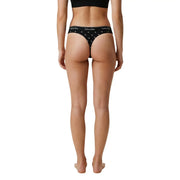String brésilien noir Calvin Klein pour femme, en coton modal avec logo blanc et motif étoile, vu de dos