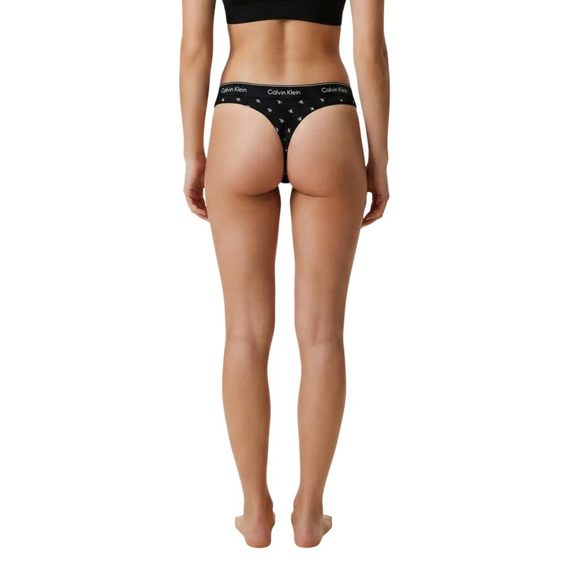 String brésilien noir Calvin Klein pour femme, en coton modal avec logo blanc et motif étoile, vu de dos