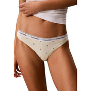 Culotte de bikini Calvin Klein couleur crème en coton, logo blanc à la taille et motifs étoiles noires, faisant partie d'un lot de 5.