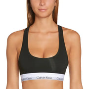 Black Calvin Klein sports bra with white logo band on grey marl slip-on underwear