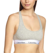 Gray heathered Calvin Klein sports bra with white elastic band and black logo