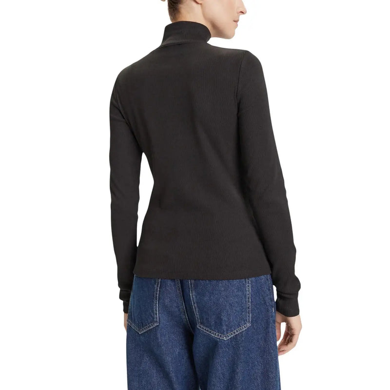 Pull à col roulé en maille côtelée noire en coton top pour les femmes par Calvin Klein avec un design classique ajusté