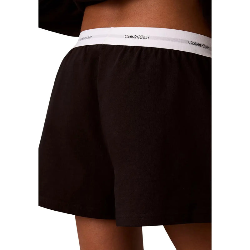 Calvin Klein Boxer noir en jersey de coton pour femme, avec ceinture élastique blanche ornée du logo de la marque