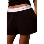 Calvin Klein Short en jersey de coton noir pour femme, avec logo et taille élastique blanche.