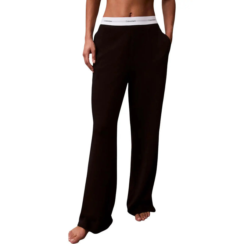 Pantalon large en jersey de coton noir Calvin Klein pour femme, avec logo et taille élastique blanche.