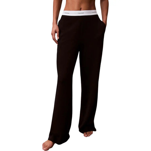 Pantalon large en jersey de coton noir Calvin Klein pour femme, avec logo et taille élastique blanche.