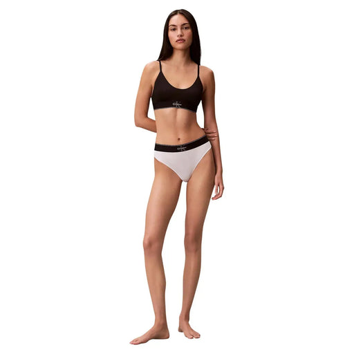 Ensemble bikini Calvin Klein pour femme, noir et blanc, en polyester, au design minimaliste et élégant, style string.