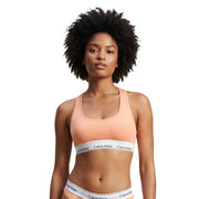 couleur pêche Calvin Klein Soutien-gorge de sport sans doublure pour femme, avec bande logo blanche, en coton modal gris.