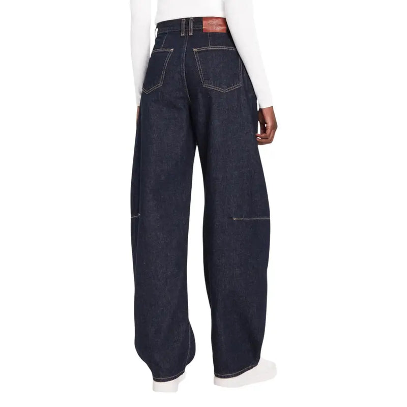 Calvin Klein Jean en denim indigo foncé à jambes larges pour femme avec surpiqûres blanches