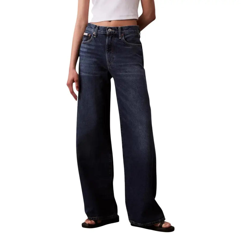 Dark-wash denim jeans with high-rise wide-leg cut and classic five-pocket design from calvin klein bordeaux collection
