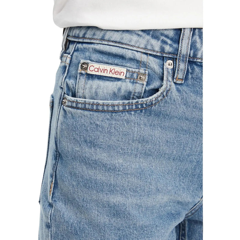 Back side of light-wash cotton denim jeans featuring a classic calvin klein brand label on the back pocket
