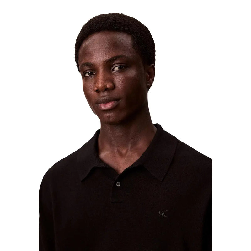 Calvin Klein Pull en laine noire pour homme avec logo brodé discret sur la poitrine, vue de face