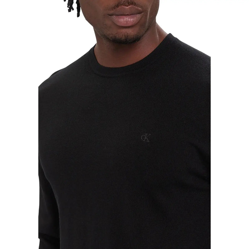 Calvin Klein Pull en laine noire pour homme avec logo brodé discret sur la poitrine, vue de face
