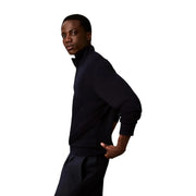 Calvin Klein Pull en laine noire pour homme, au design minimaliste et élégant, col roulé, vue de face