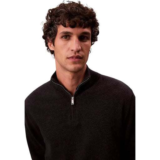 Calvin Klein Pull à col roulé en laine mérinos noire pour homme, avec demi-zip argenté, vue de face