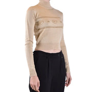 Women’s beige long-sleeve turtleneck crop top with horizontal stripes and eye/star patterns