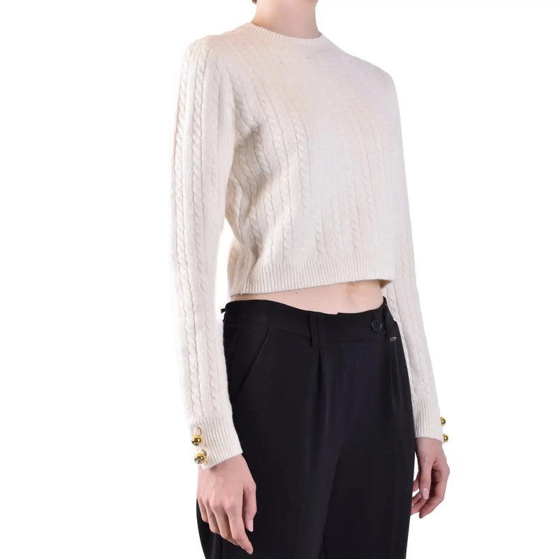 Pull court en laine blanche à col rond et poignets boutonnés dorés, orné de torsades, signé Chiara Ferragni.