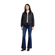 Black leather jacket with brown shearling collar and flap pockets paired with choral women green cotton blazer classic zip pocket