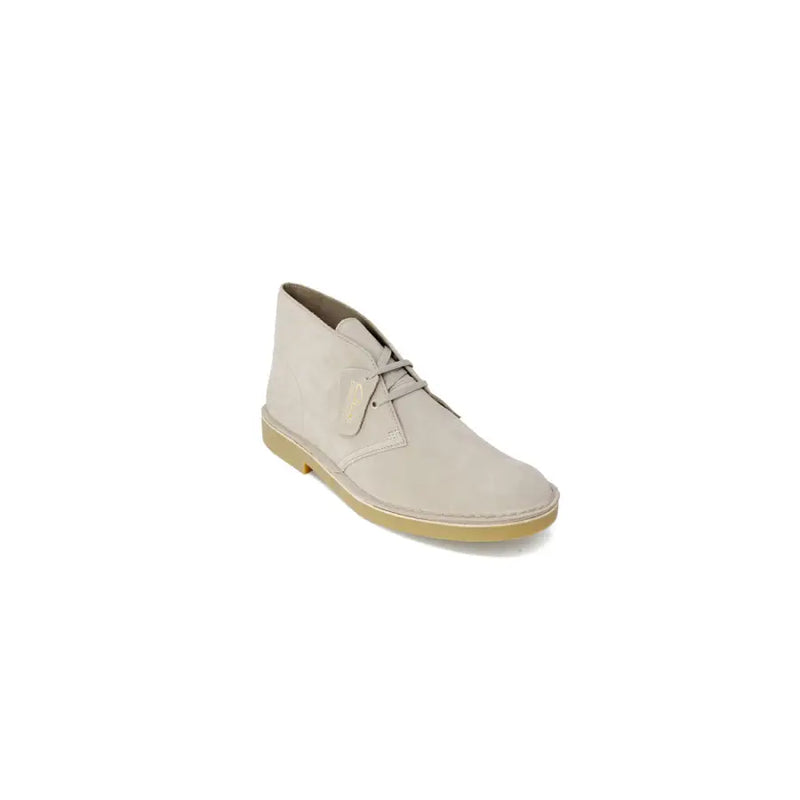 Bottines désert Clarks en daim beige avec semelle en caoutchouc beige et fermeture à lacets, pointure 2,5.