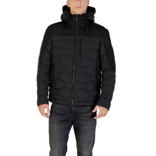 Black puffer jacket with hood and zipper, made of synthetic material.