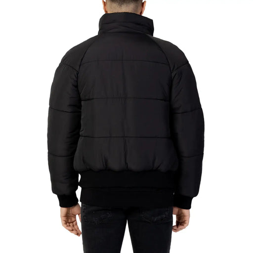 Cnc Costume National Doudoune matelassée en coton noir pour homme, avec col montant et poignets côtelés
