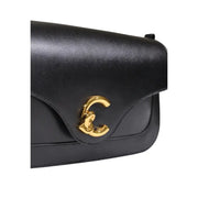 Black leather Chanel handbag with gold-tone interlocking CC clasp and inside pocket by Coccinelle