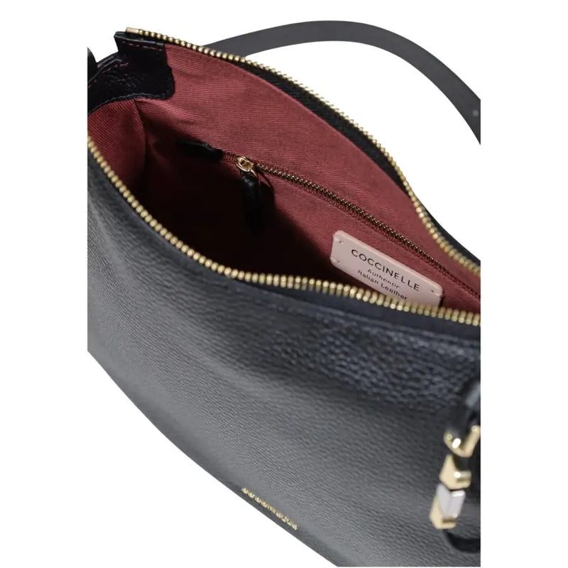 Coccinelle black leather handbag with gold-tone zipper and burgundy interior lining shown from the back side