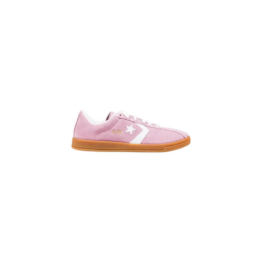 Converse Baskets classiques en cuir rose pour femme, modèle Ox, en daim rose avec une bande étoile blanche et semelle en caoutchouc beige.