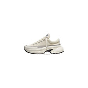 Converse women slip on fabric sneakers white featuring cream canvas upper chunky white sole and black accents