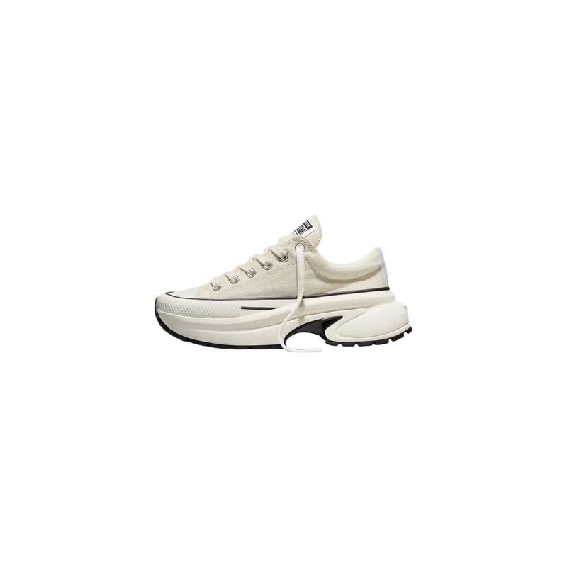Converse women slip on fabric sneakers white featuring cream canvas upper chunky white sole and black accents