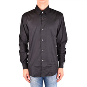 Chemise Costume National pour homme en coton noir à manches longues, col classique et boutons blancs, vue de face