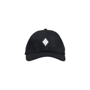 Black baseball cap with white pixelated cross design, adjustable strap.