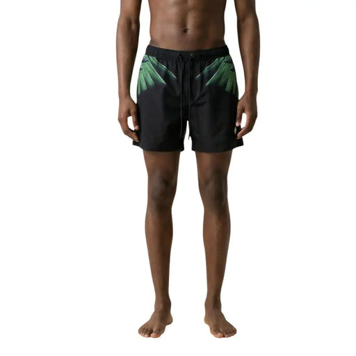 Short de bain homme County of Milan en polyester noir avec imprimé de feuilles de palmier vert vif sur les côtés