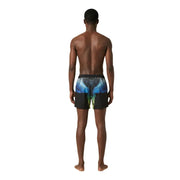 Vue arrière d'un short de bain homme County of Milan en polyester noir avec un motif d'ailes bleu et vert vif.