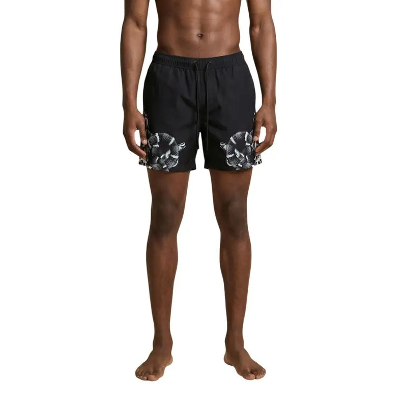 Black swim trunks by County Of Milan featuring a bold white snake pattern on the lower legs for men swimwear