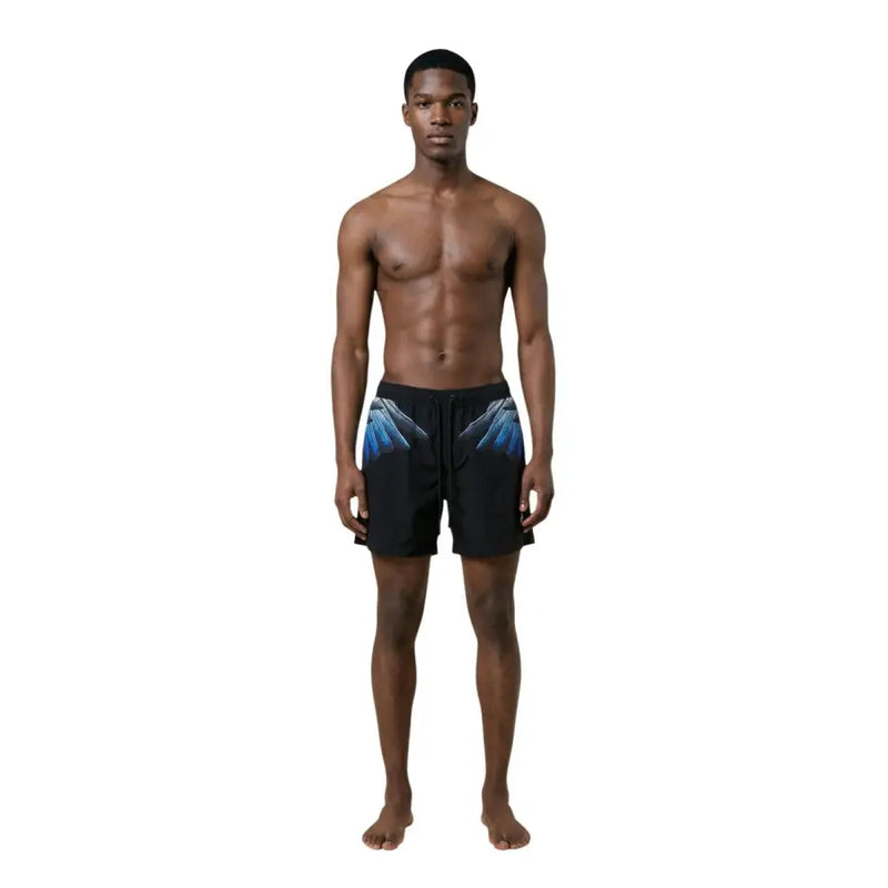 County of Milan men swimwear black swim trunks with vibrant blue wing graphic on side for stylish beachwear