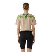 Haut court beige en coton pour femme, County of Milan top avec un motif d'aile vert et blanc éclatant sur les épaules