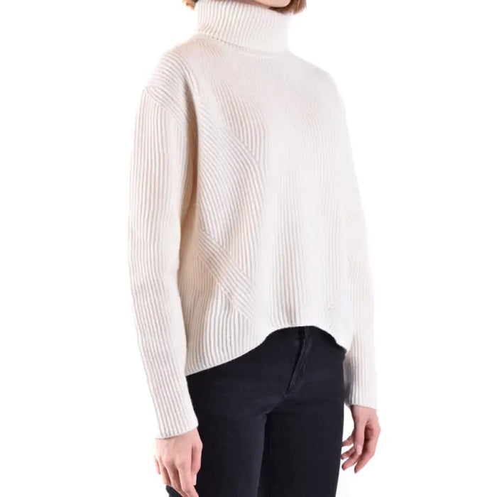 Cream-colored ribbed turtleneck sweater displayed in the product listing