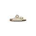 Cream-colored two-strap sandal with gold buckles displayed in Cream Two Strap Sandal with Gold Buckles product image